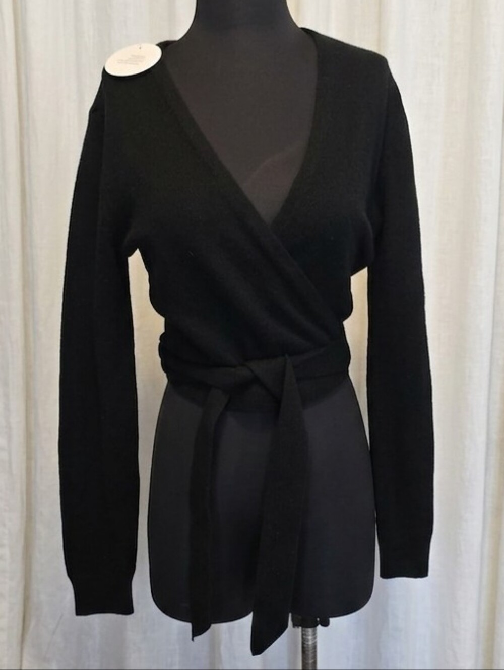 Hill House Home The Ballet Wrap Sweater in black, featuring a self-tie waist.
